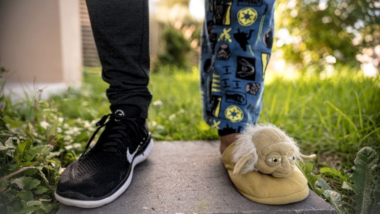 brown bear plush toy on black and blue shoes